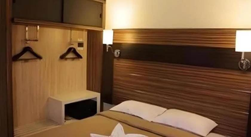 Bed in Travello Hotel Manado