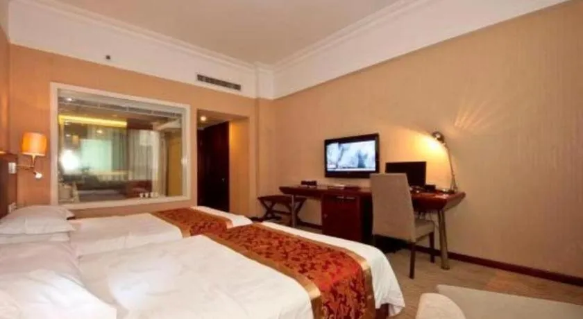 Bed in Fujian Galaxy Garden Hotel