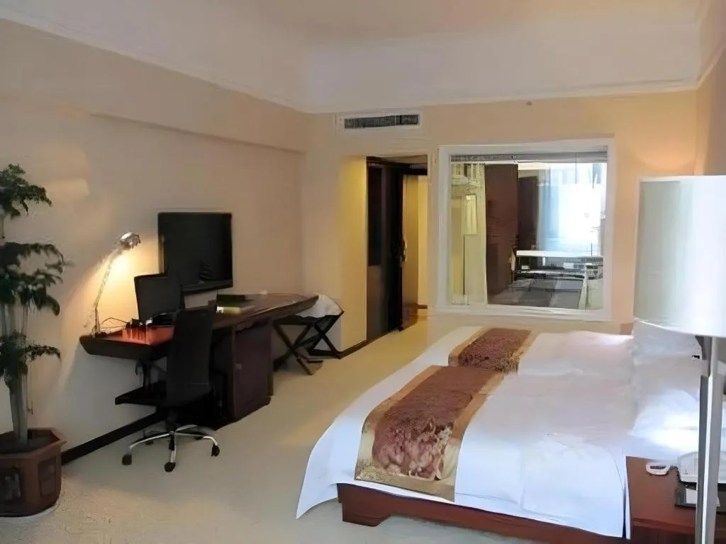 Bed in Fujian Galaxy Garden Hotel