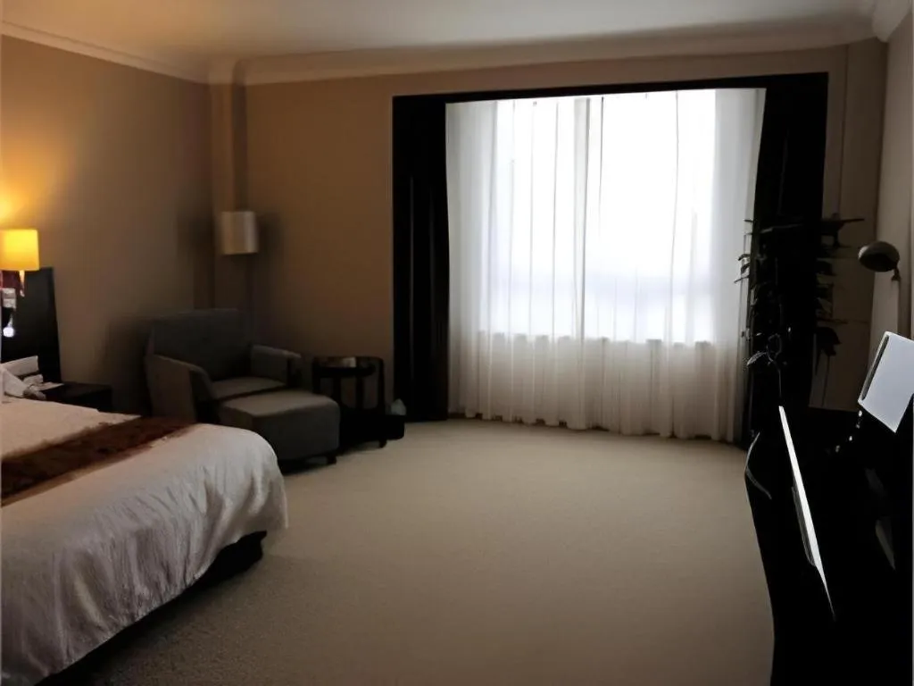 Bed in Fujian Galaxy Garden Hotel