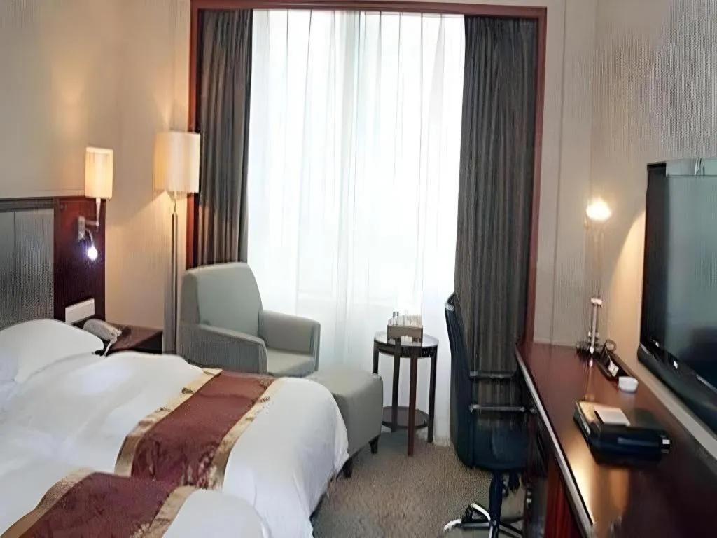 Bed in Fujian Galaxy Garden Hotel