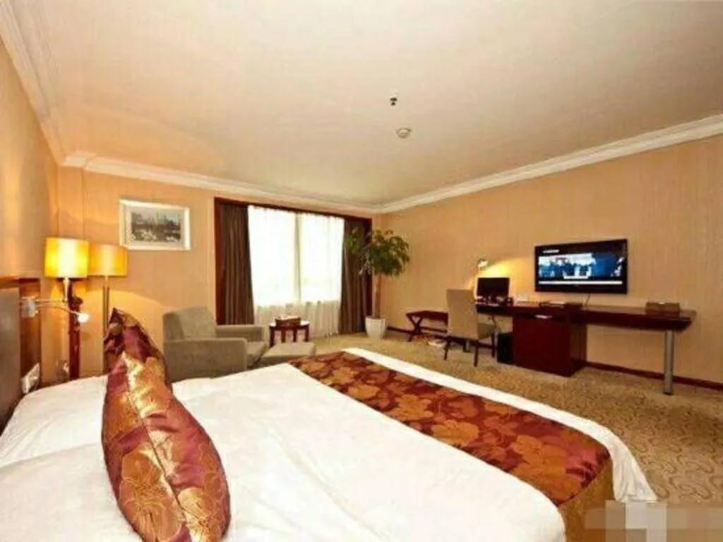 Bed in Fujian Galaxy Garden Hotel