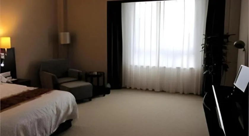 Bed in Fujian Galaxy Garden Hotel