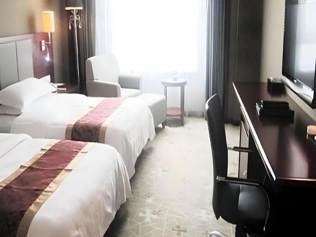 Bed in Fujian Galaxy Garden Hotel