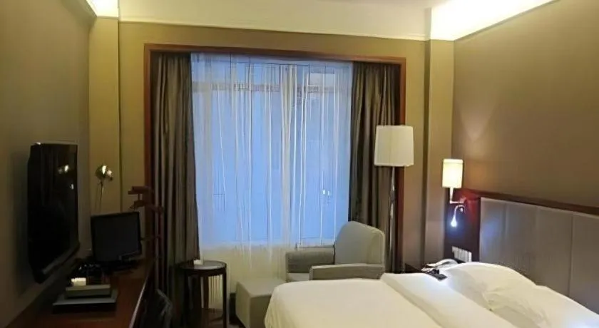 Bed in Fujian Galaxy Garden Hotel