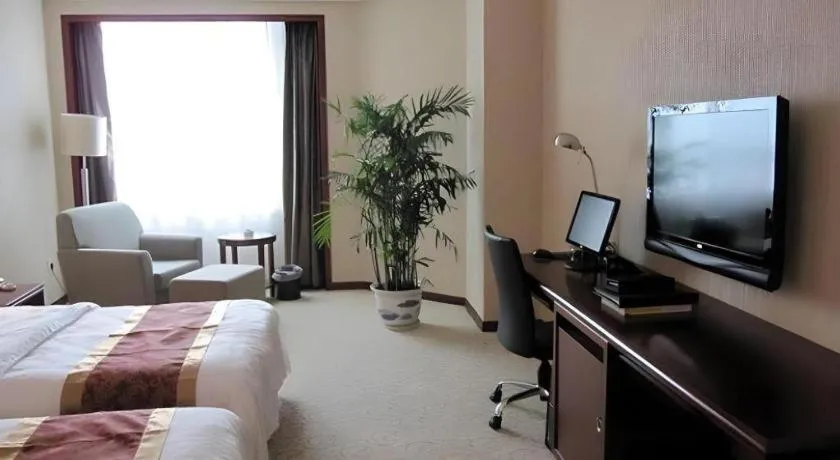 Bed in Fujian Galaxy Garden Hotel