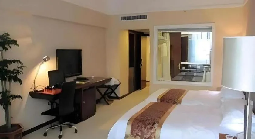 Bed in Fujian Galaxy Garden Hotel