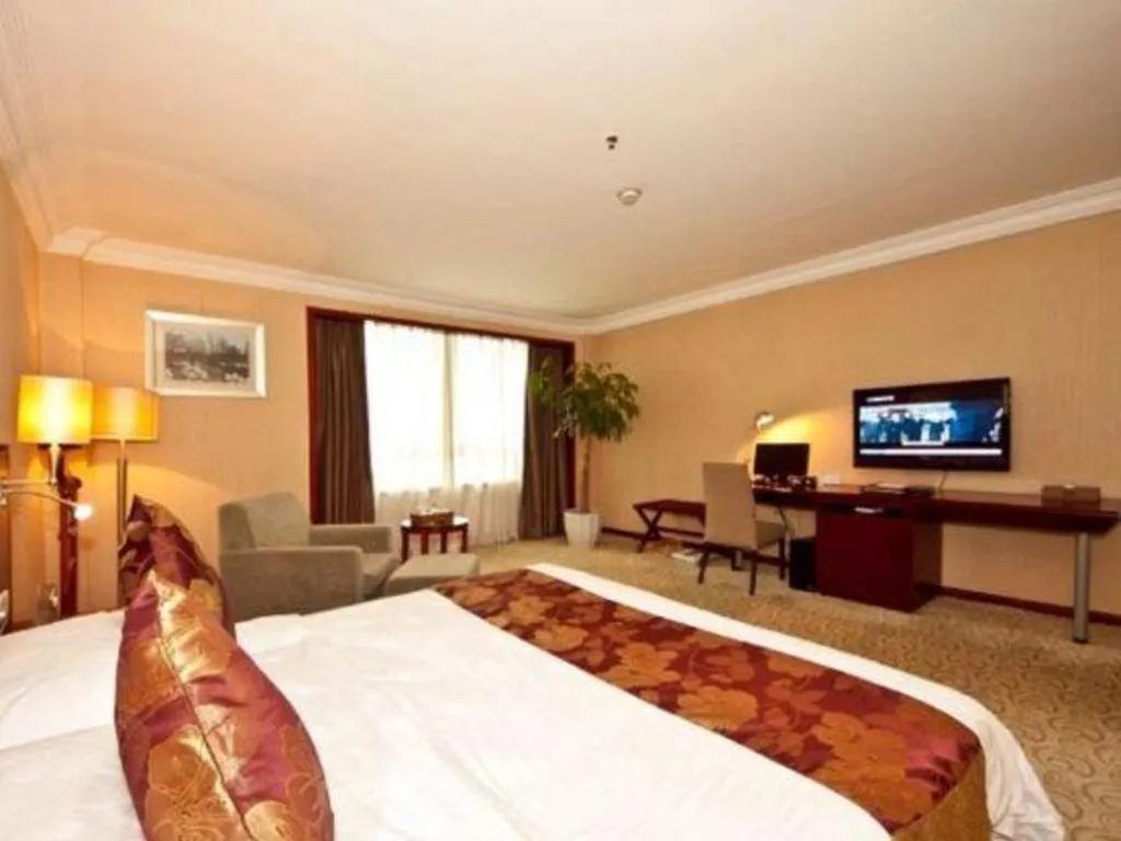 Bed in Fujian Galaxy Garden Hotel