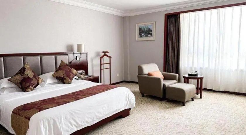 Bed in Fujian Galaxy Garden Hotel