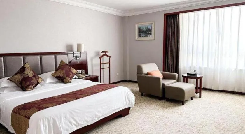 Bed in Fujian Galaxy Garden Hotel