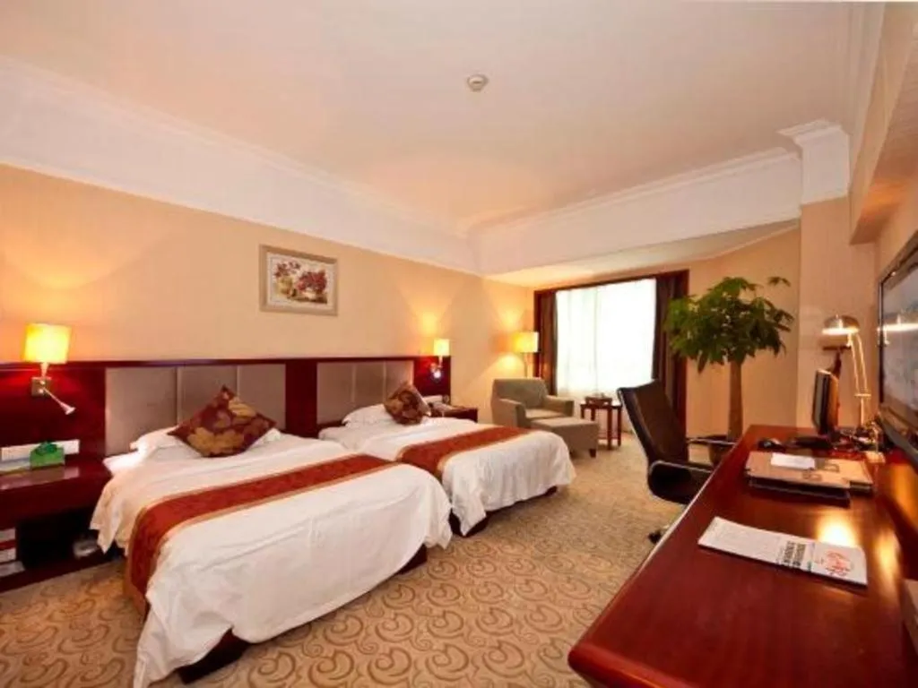 Bed in Fujian Galaxy Garden Hotel