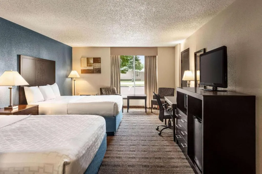 Bed in AmericInn by Wyndham La Crosse Riverfront-Conference Center