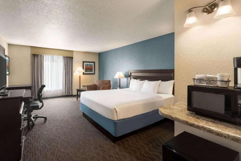Bed in AmericInn by Wyndham La Crosse Riverfront-Conference Center
