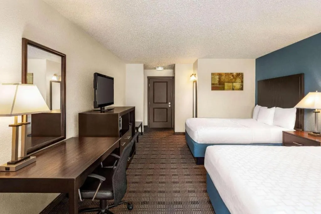 Bed in AmericInn by Wyndham La Crosse Riverfront-Conference Center