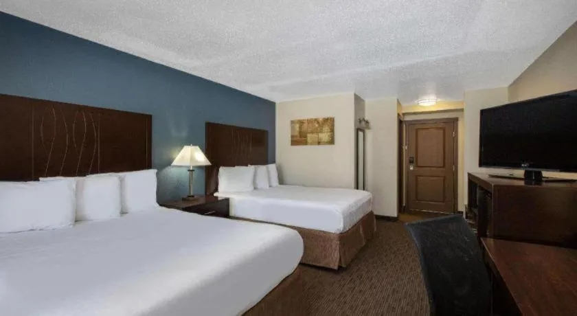 Bed in AmericInn by Wyndham La Crosse Riverfront-Conference Center