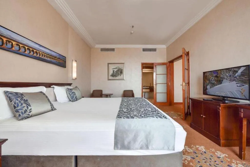 Bed in Dandong Rising Zhonglian Hotel