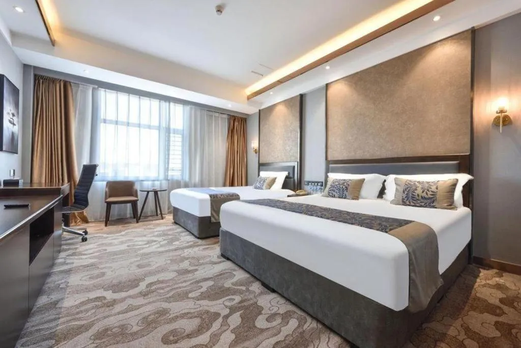 Bed in Dandong Rising Zhonglian Hotel
