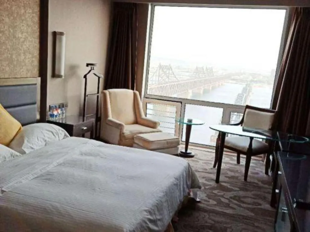 Bed in Dandong Rising Zhonglian Hotel