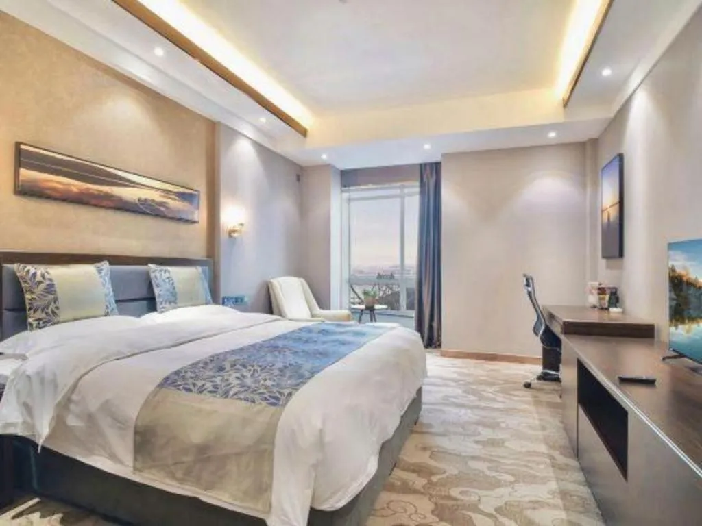Bed in Dandong Rising Zhonglian Hotel