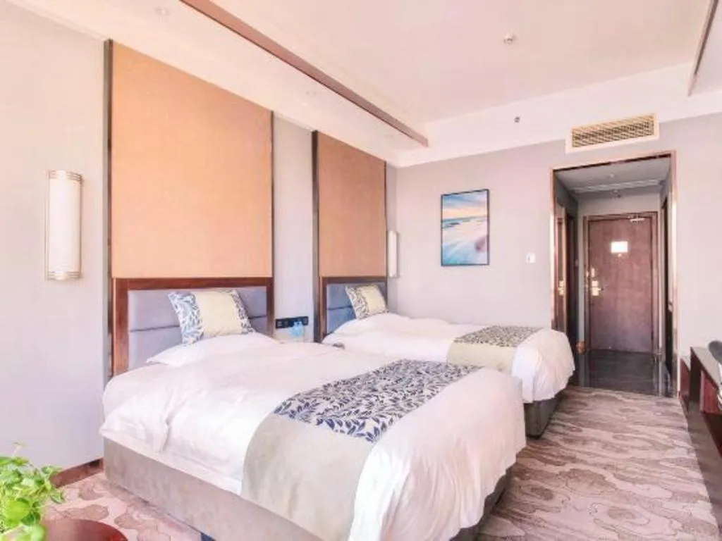 Bed in Dandong Rising Zhonglian Hotel