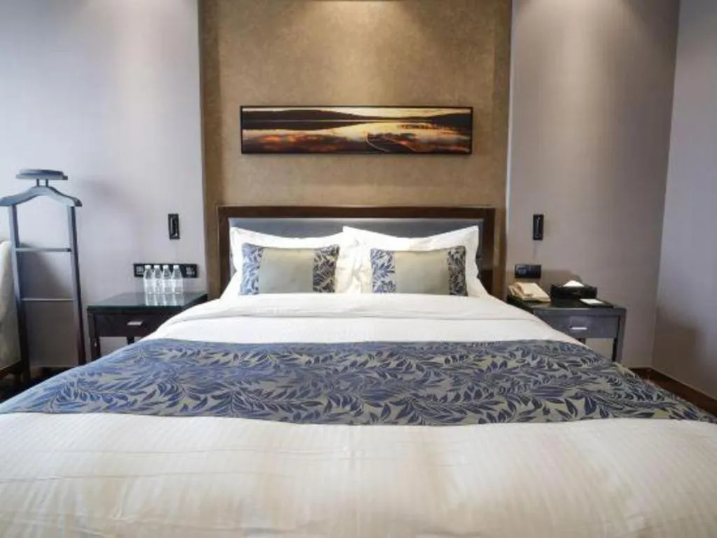 Bed in Dandong Rising Zhonglian Hotel