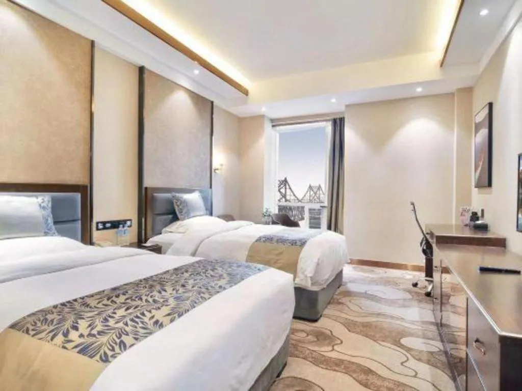 Bed in Dandong Rising Zhonglian Hotel