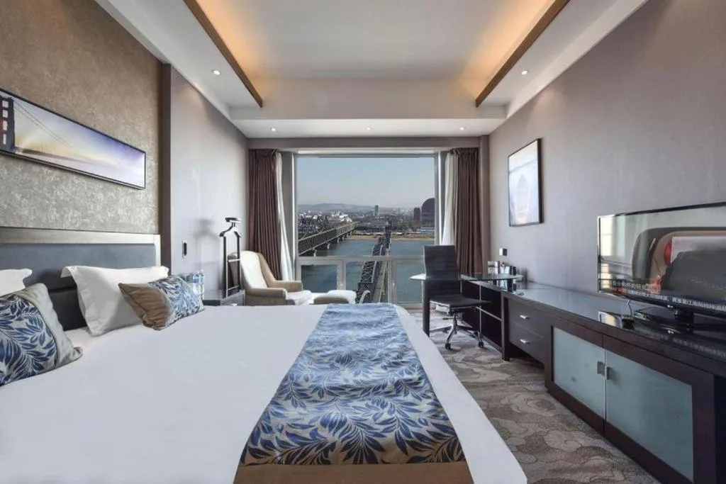 Bed in Dandong Rising Zhonglian Hotel