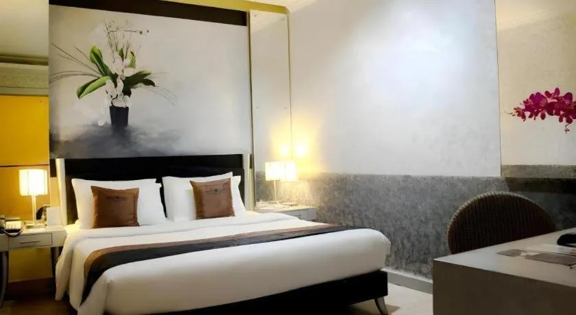 Bed in Amos Cozy Hotel Melawai