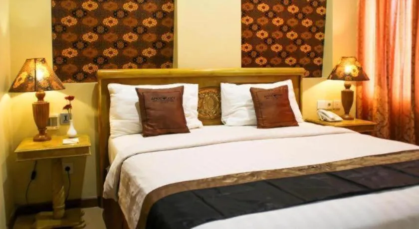Bed in Amos Cozy Hotel Melawai