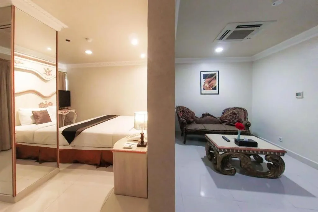 Bed in Amos Cozy Hotel Melawai