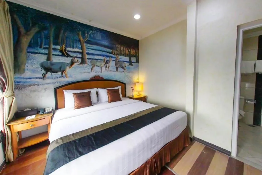 Bed in Amos Cozy Hotel Melawai