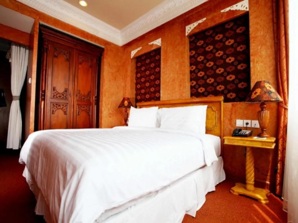 Bed in Amos Cozy Hotel Melawai