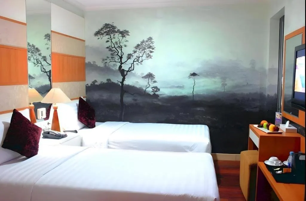 Bed in Amos Cozy Hotel Melawai