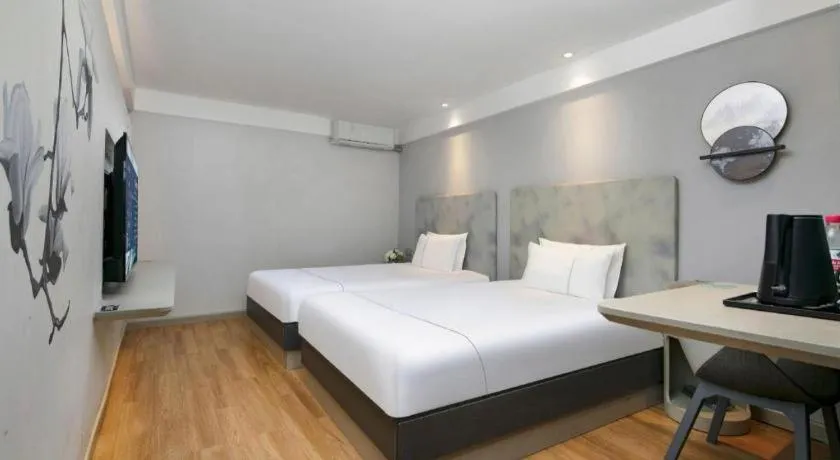 Bed in Magnotel Ningbo Tianyi Plaza Railway Station