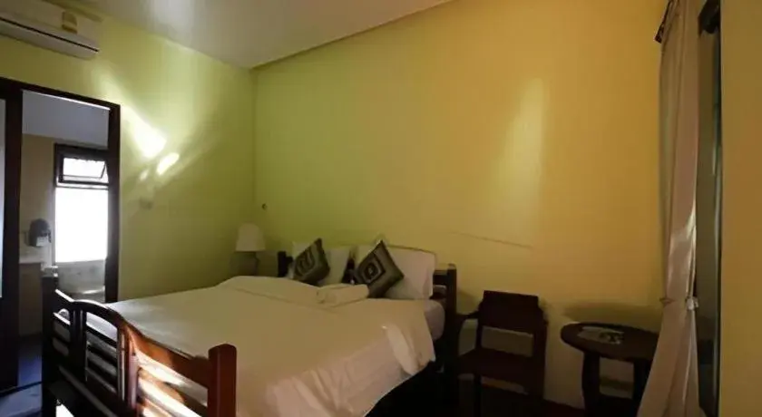 Bed in Baan Lapoon Hotel Bed in Baan Lapoon Hotel