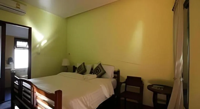 Bed in Baan Lapoon Hotel