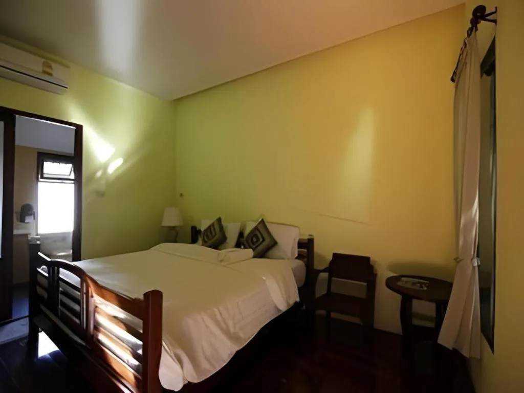 Bed in Baan Lapoon Hotel