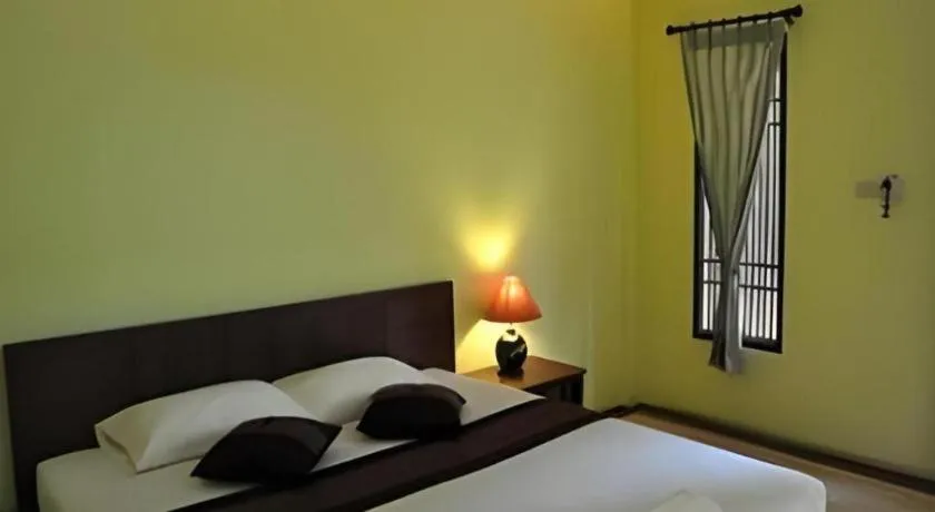 Bed in Baan Lapoon Hotel