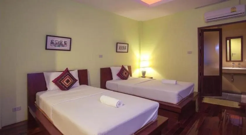 Bed in Baan Lapoon Hotel