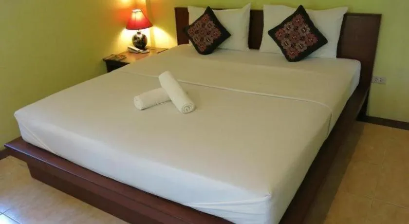 Bed in Baan Lapoon Hotel
