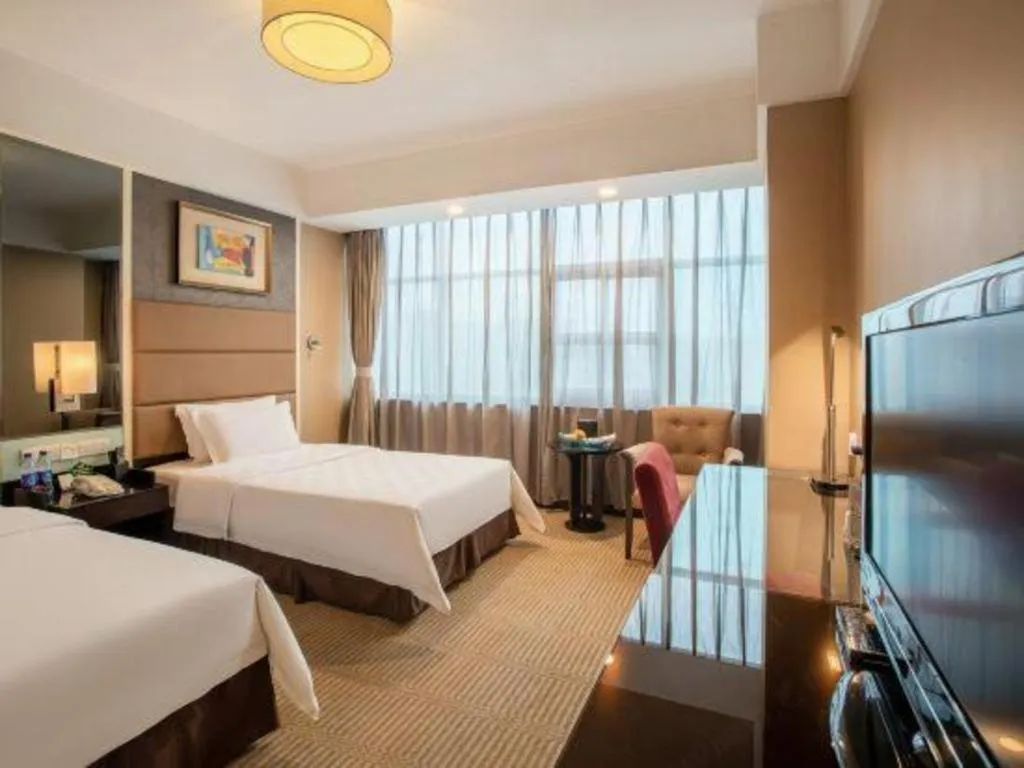 Bed in Zibo Blue Horizon International Hotel