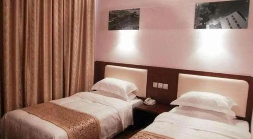 Bed in Super 8 Hotel Beijing International Exhibition Center