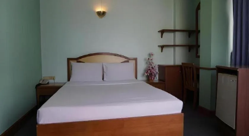 Bed in Tanaphat Hatyai Hotel