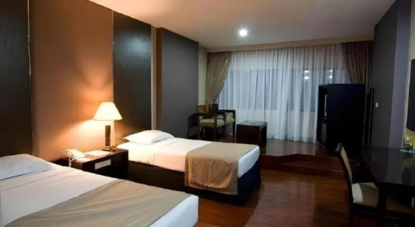 Bed in Danau Toba Hotel International