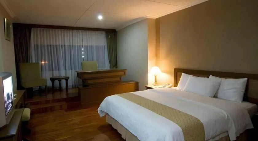 Bed in Danau Toba Hotel International