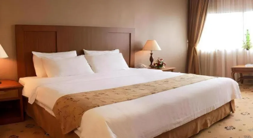 Bed in Danau Toba Hotel International