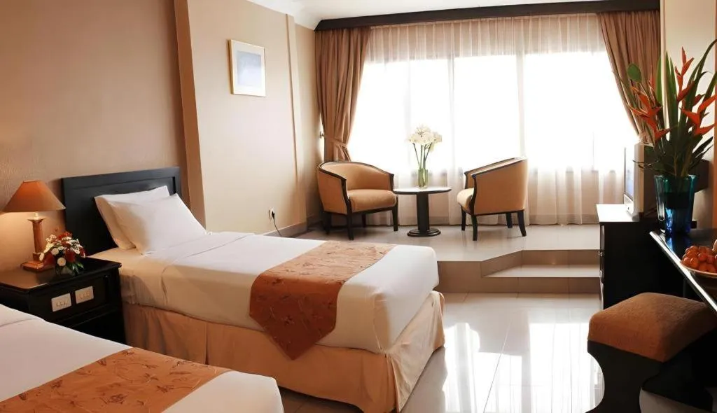 Bed in Danau Toba Hotel International