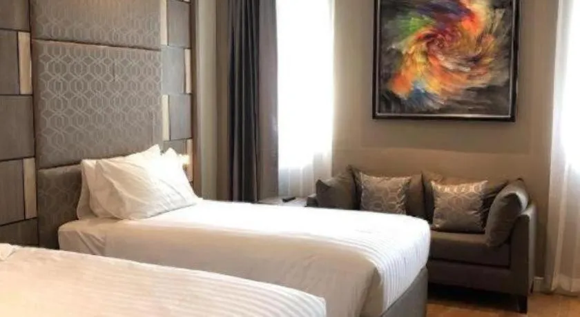 Bed in Sri U-Thong Grand Hotel