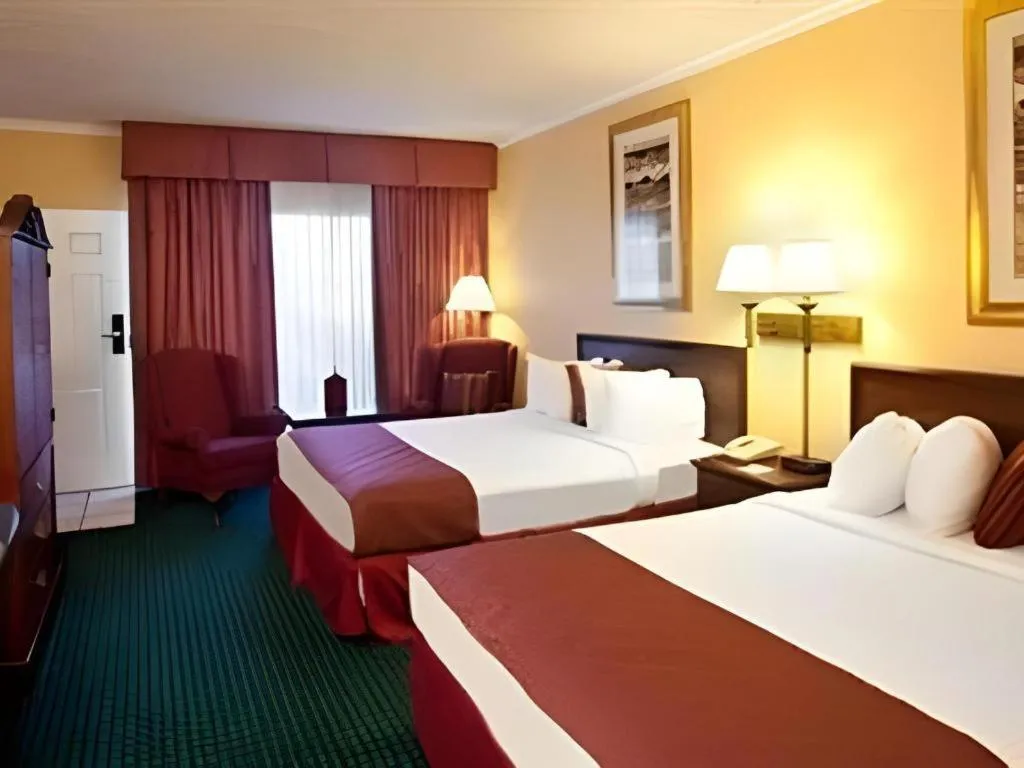 Bed in Magnuson Grand Conference Hotel