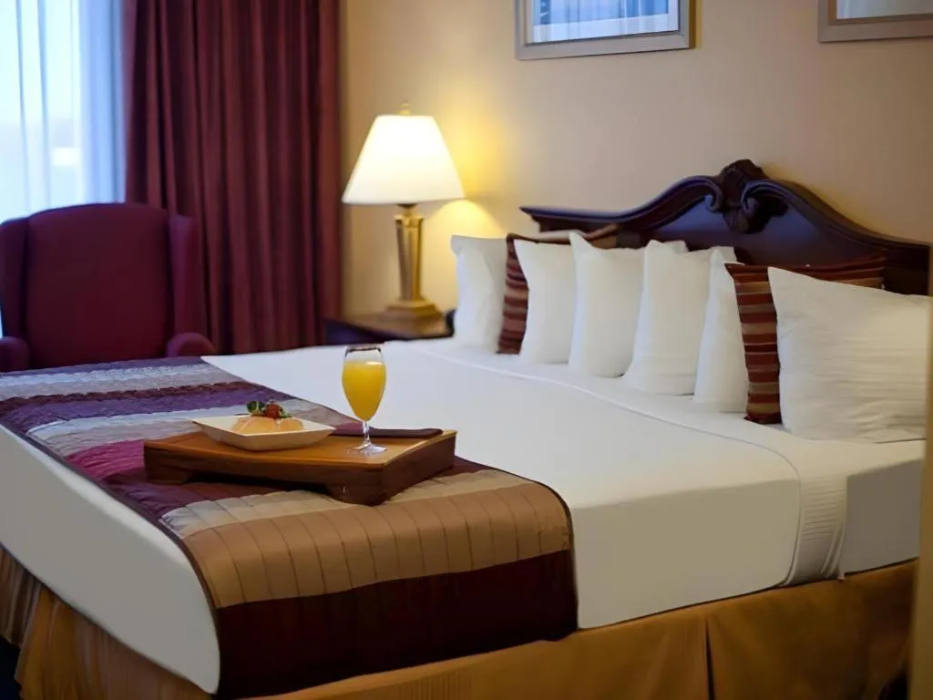 Bed in Magnuson Grand Conference Hotel